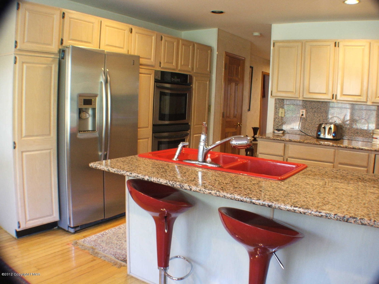 488 Rinker Road Stroudsburg, PA 18360 - Photo 14 of 54 a kitchen with stainless steel appliances granite countertop a sink and a refrigerator