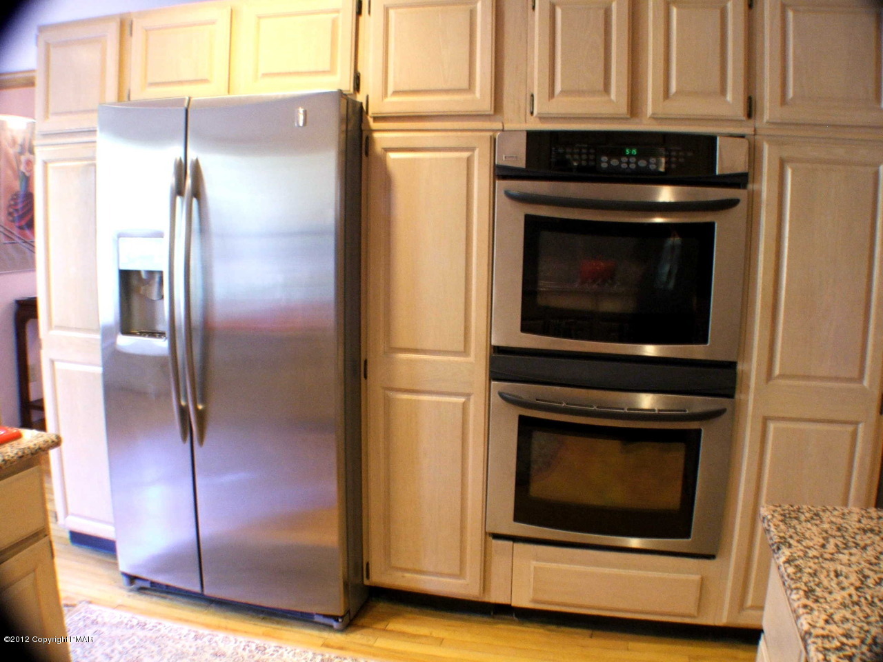 488 Rinker Road Stroudsburg, PA 18360 - Photo 17 of 54 a kitchen with granite countertop a refrigerator stove and cabinets