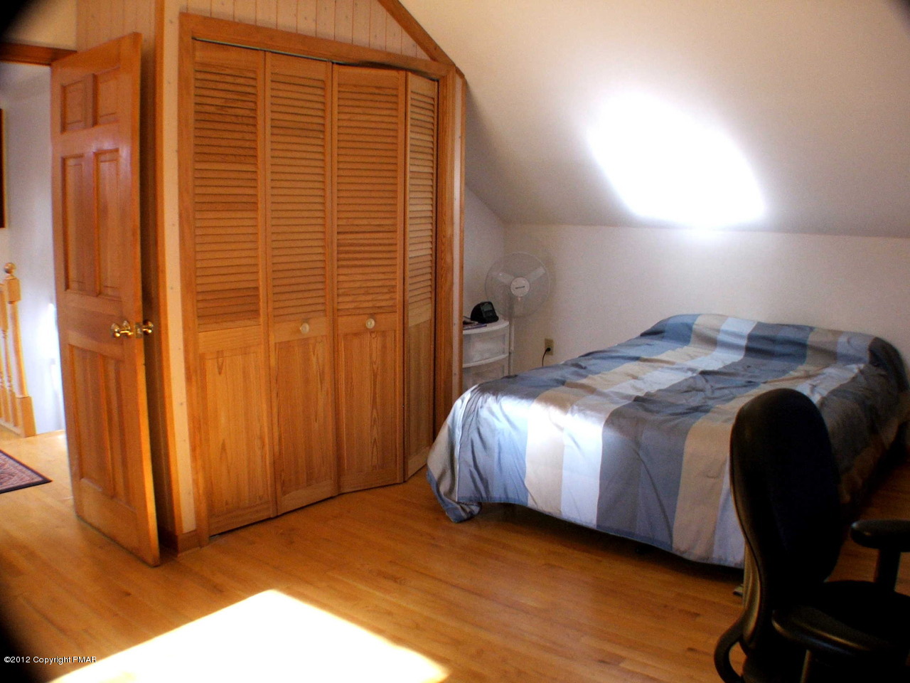 488 Rinker Road Stroudsburg, PA 18360 - Photo 46 of 54 a bedroom with a bed and a chair