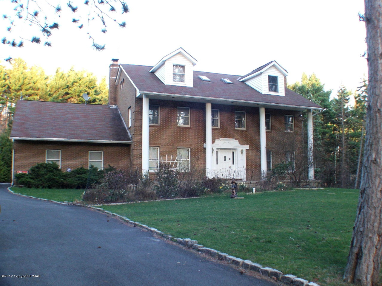 488 Rinker Road Stroudsburg, PA 18360 - Photo 48 of 54 a front view of a house with a yard and garage