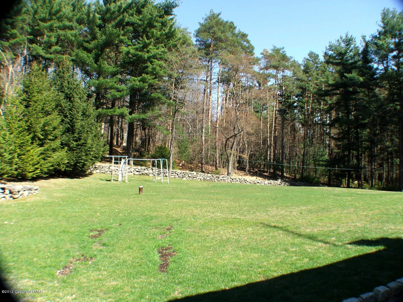 488 Rinker Road Stroudsburg, PA 18360 - Photo 50 of 54 a backyard of a house with lots of green space and fountain