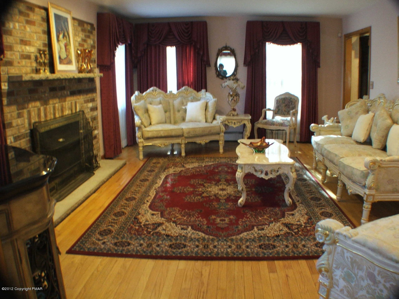 488 Rinker Road Stroudsburg, PA 18360 - Photo 5 of 54 a living room with furniture and a fireplace