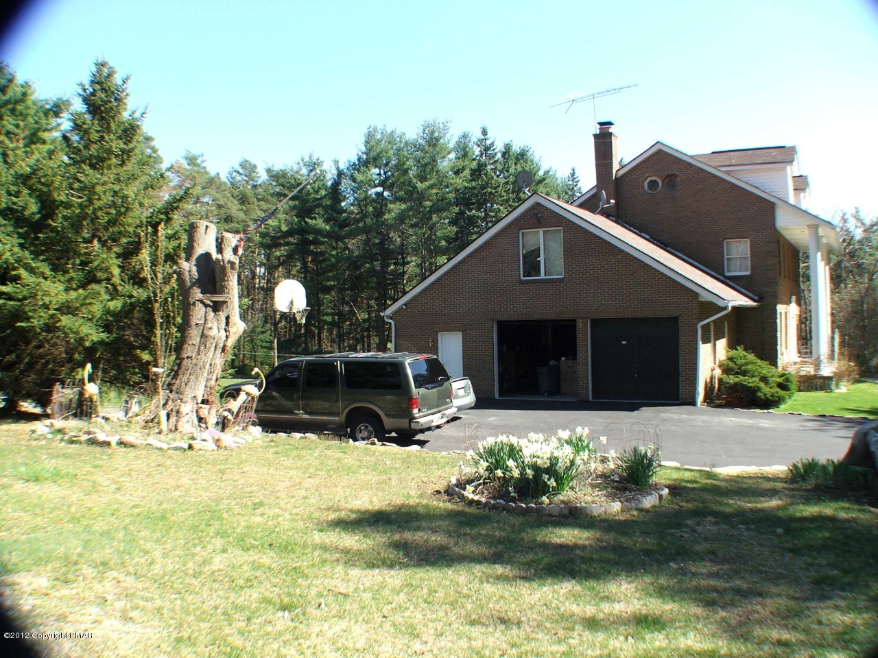 488 Rinker Road Stroudsburg, PA 18360 - Photo 52 of 54 a front view of house with yard and trees in the background