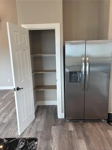 a view of kitchen with wooden floor
