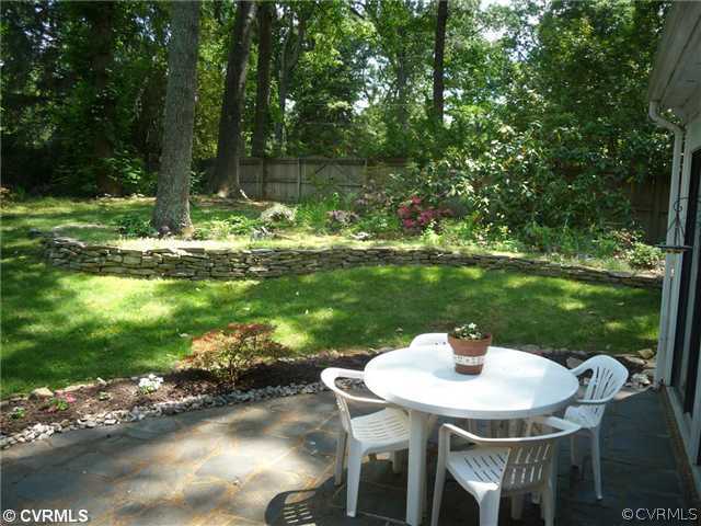 4407 Wakefield Road Richmond, VA 23225 - Photo 11 of 11 a table with chairs and a lake view