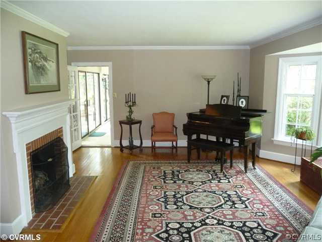 4407 Wakefield Road Richmond, VA 23225 - Photo 2 of 11 a living room with furniture and a fireplace