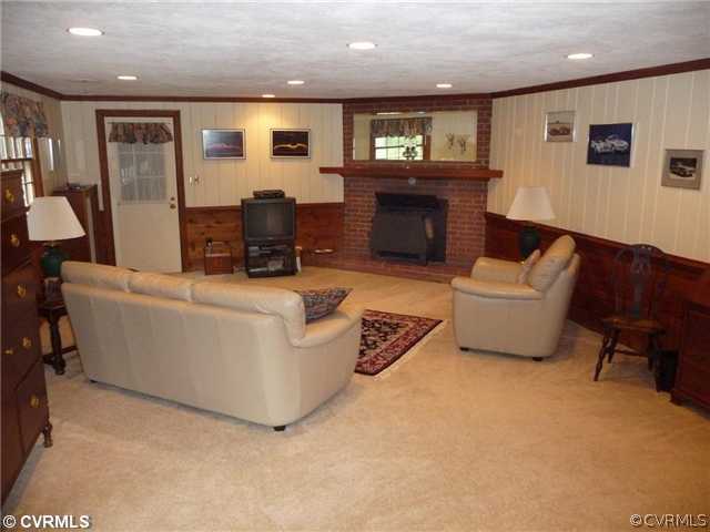 4407 Wakefield Road Richmond, VA 23225 - Photo 5 of 11 a living room with furniture and a fireplace