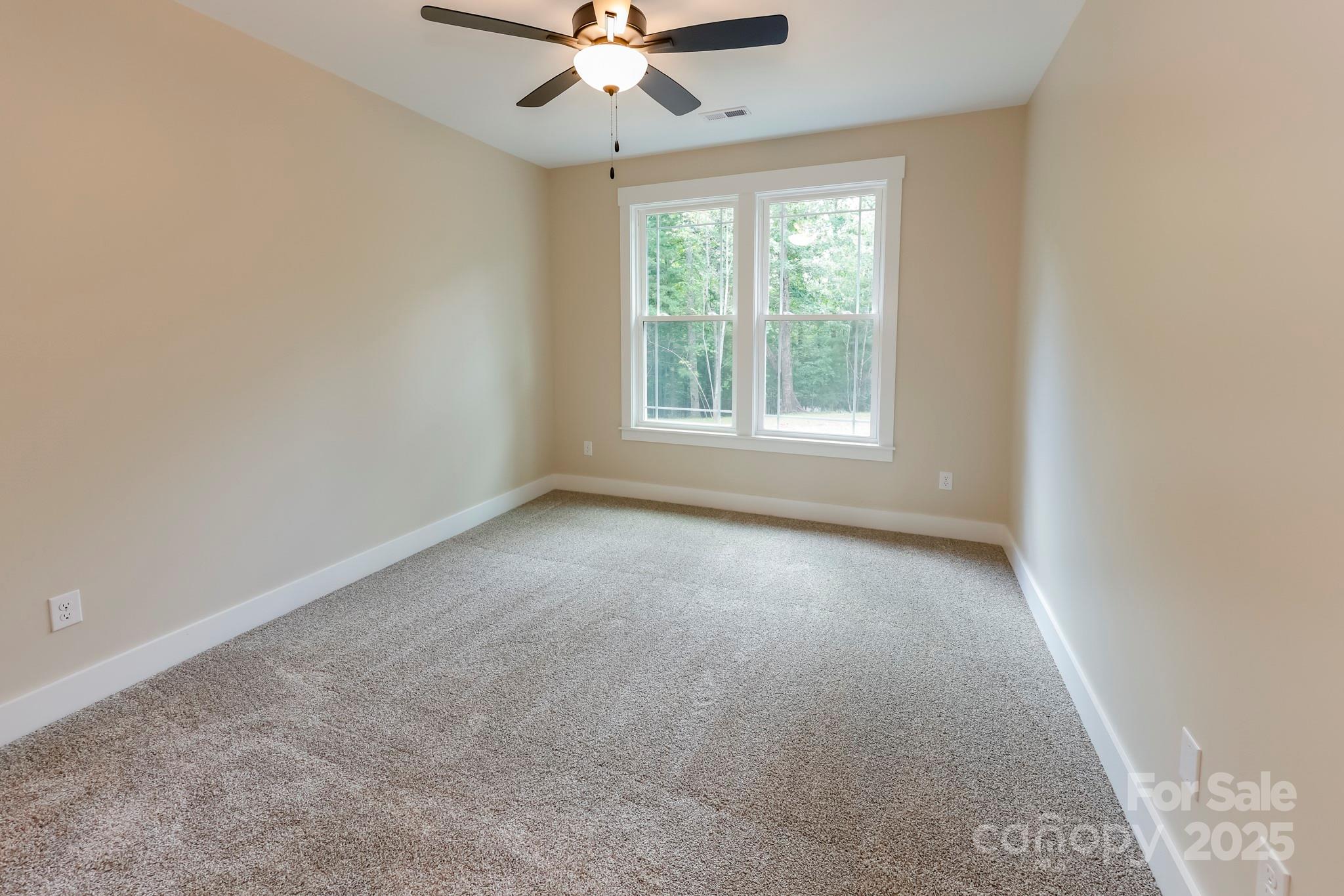 160 Northridge Drive Rutherfordton, NC 28139 - Photo 19 of 37 an empty room with a window and a fan