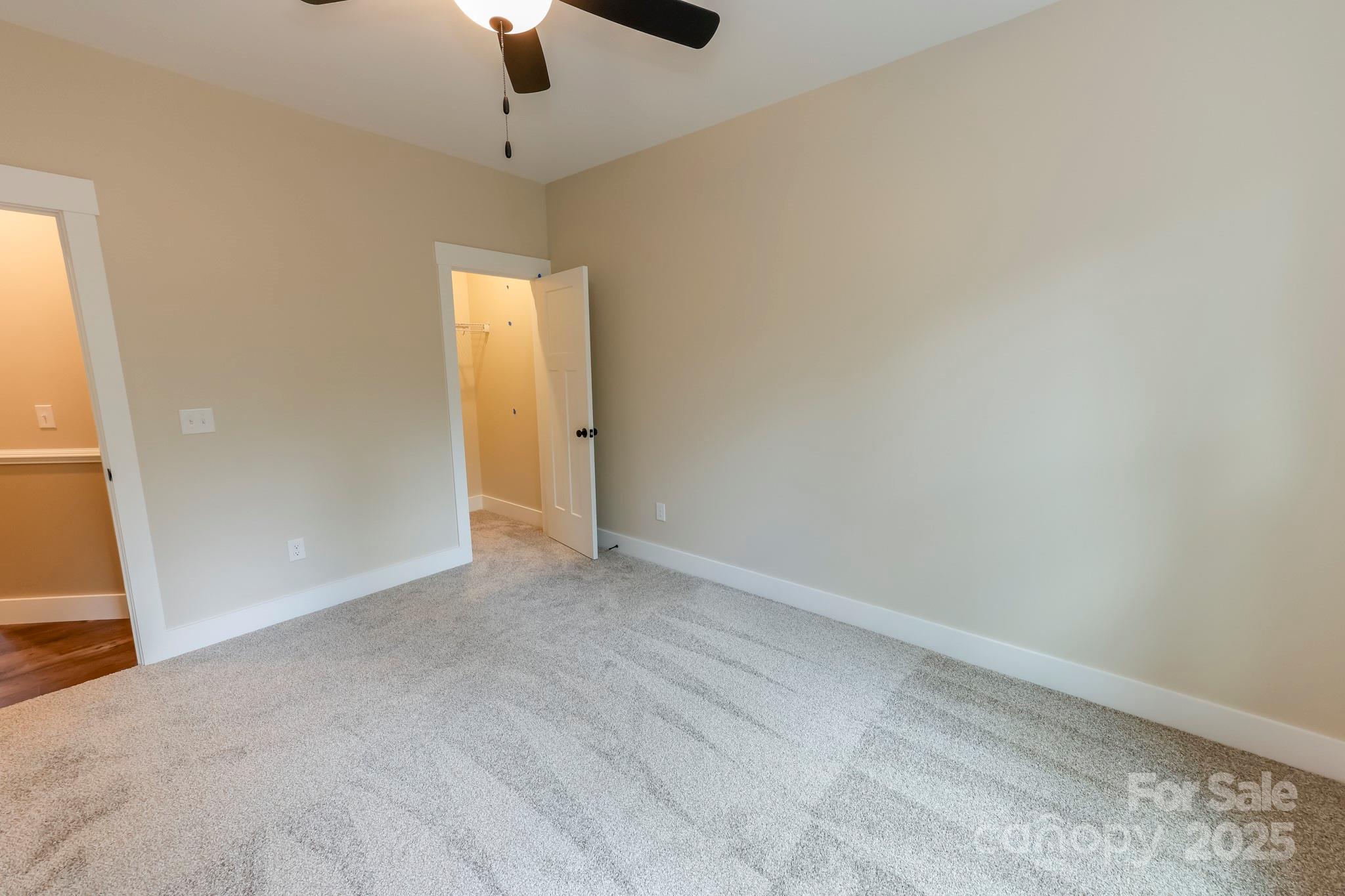 160 Northridge Drive Rutherfordton, NC 28139 - Photo 20 of 37 a view of an empty room with window and chandelier fan
