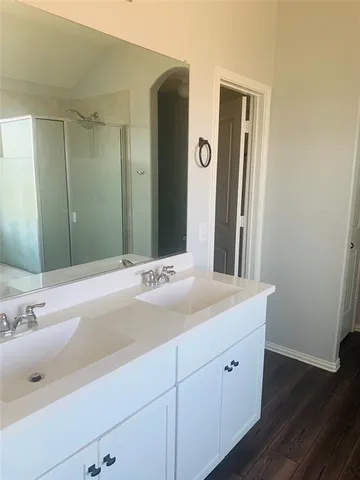a bathroom with a sink and a mirror