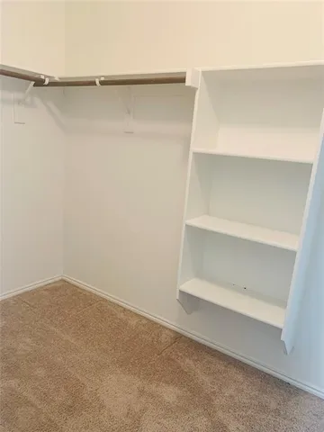 a view of an empty walk in closet