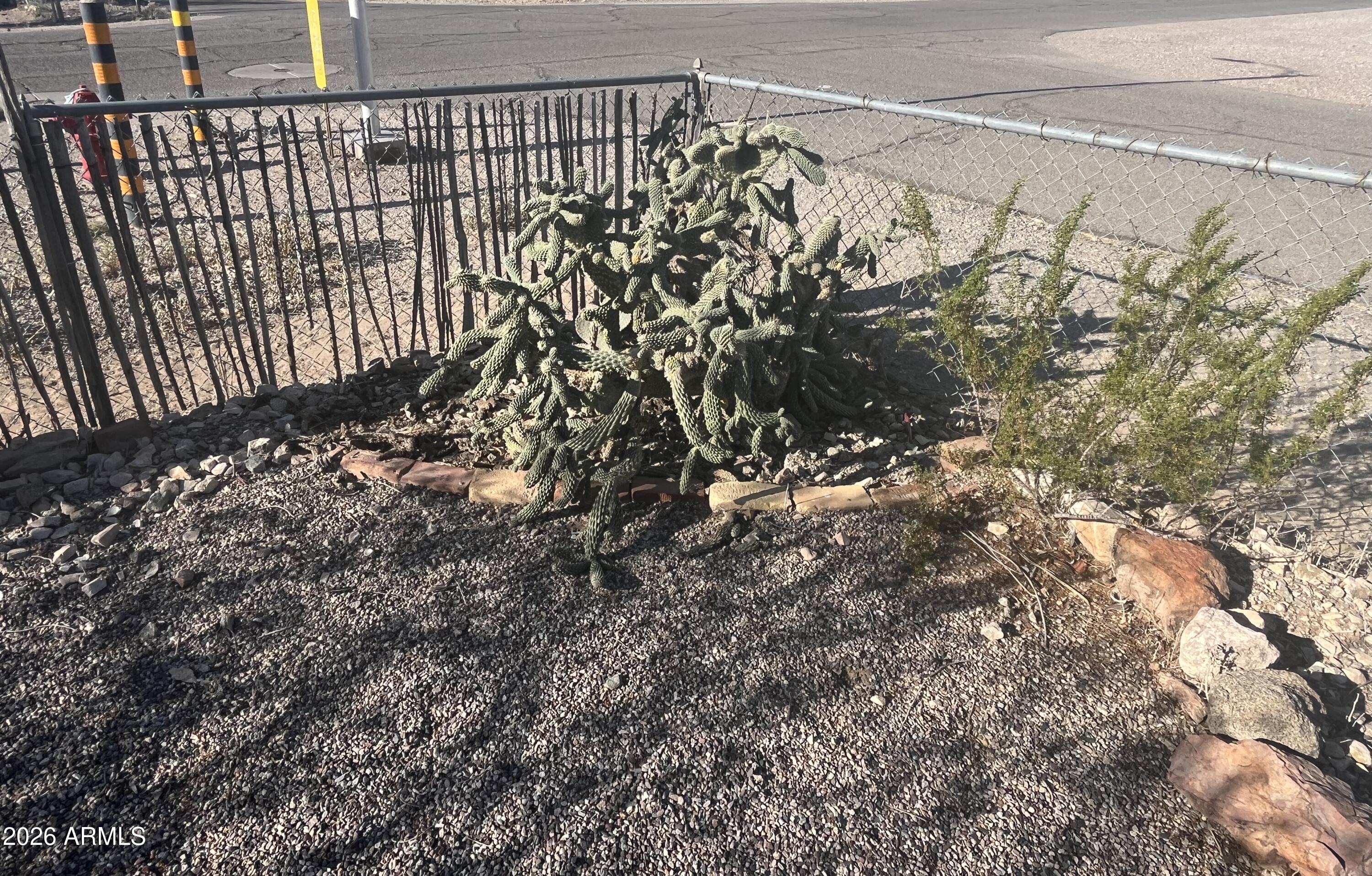 640 West Rocalla Avenue Ajo, AZ 85321 - Photo 21 of 27 a view of a backyard of the house