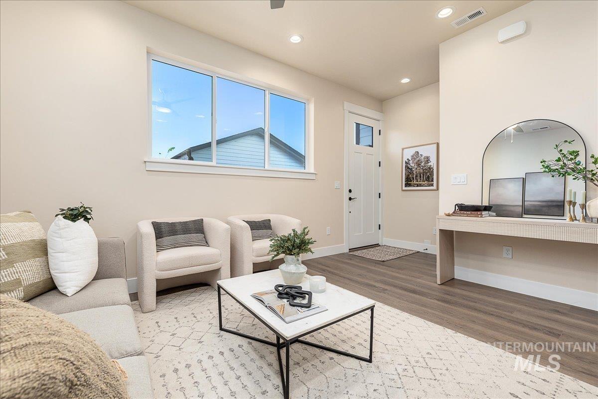 1439 North Bluffs Ridge Lane Boise, ID 83704 - Photo 18 of 47 Living area featuring wood finished floors and recessed lighting