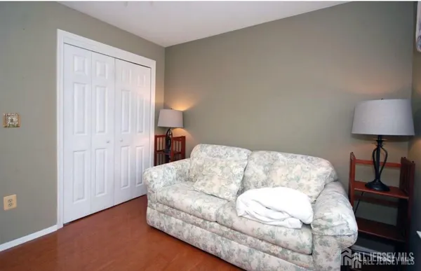 a bedroom with a bed and a lamp