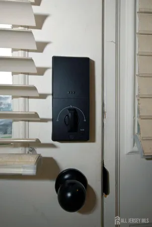 a utility room with washing machine and racks