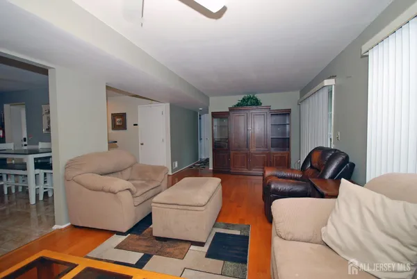 a living room with furniture and a rug