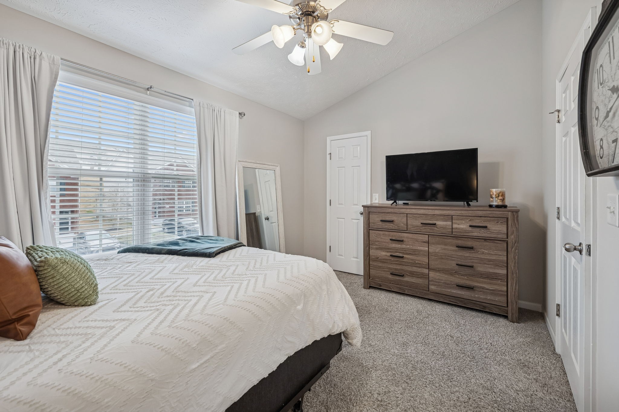 1834 Shaylin Loop Antioch, TN 37013 - Photo 17 of 28 a bedroom with a bed and a flat screen tv