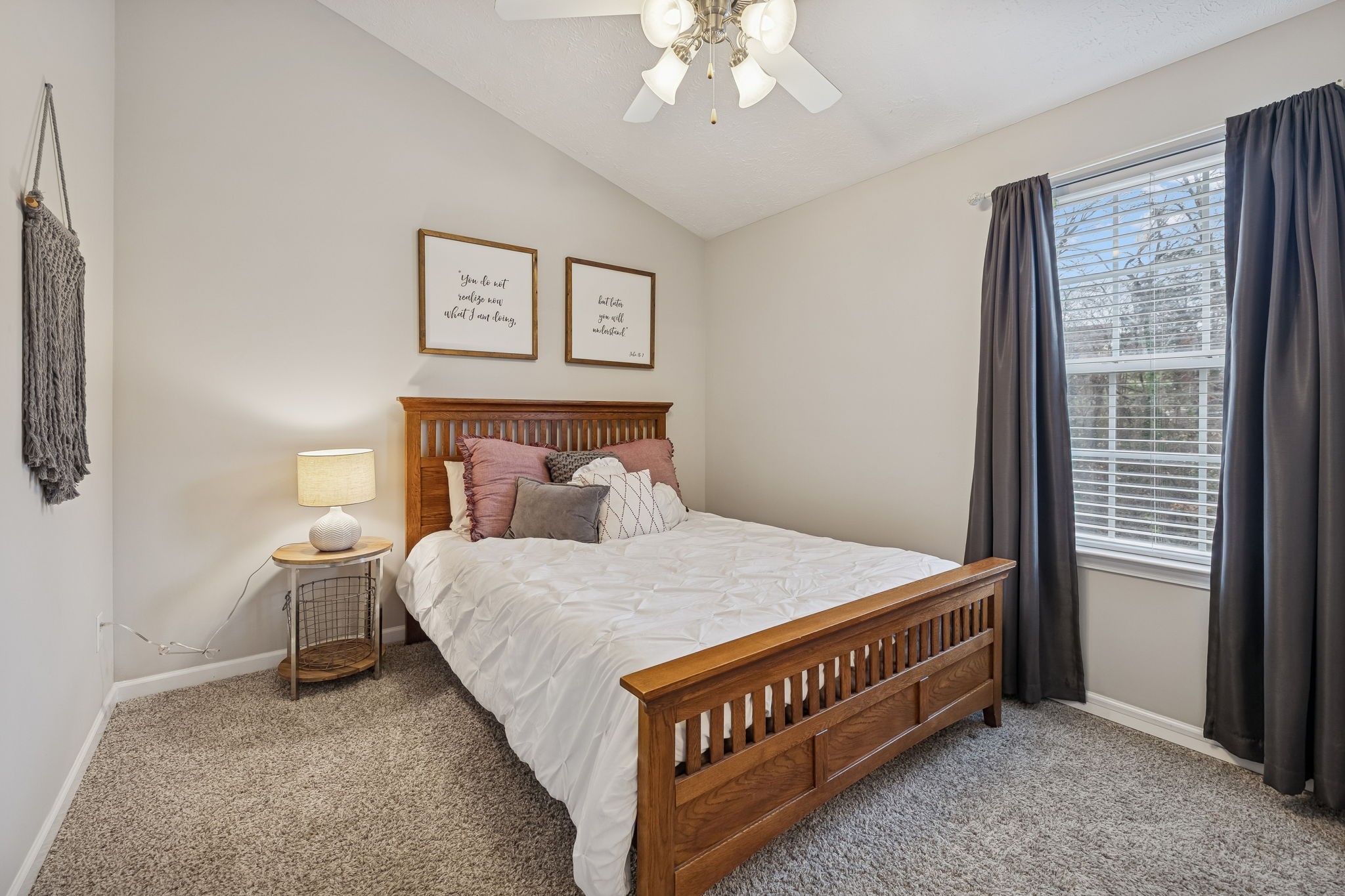 1834 Shaylin Loop Antioch, TN 37013 - Photo 20 of 28 a bed sitting in a bedroom next to a window