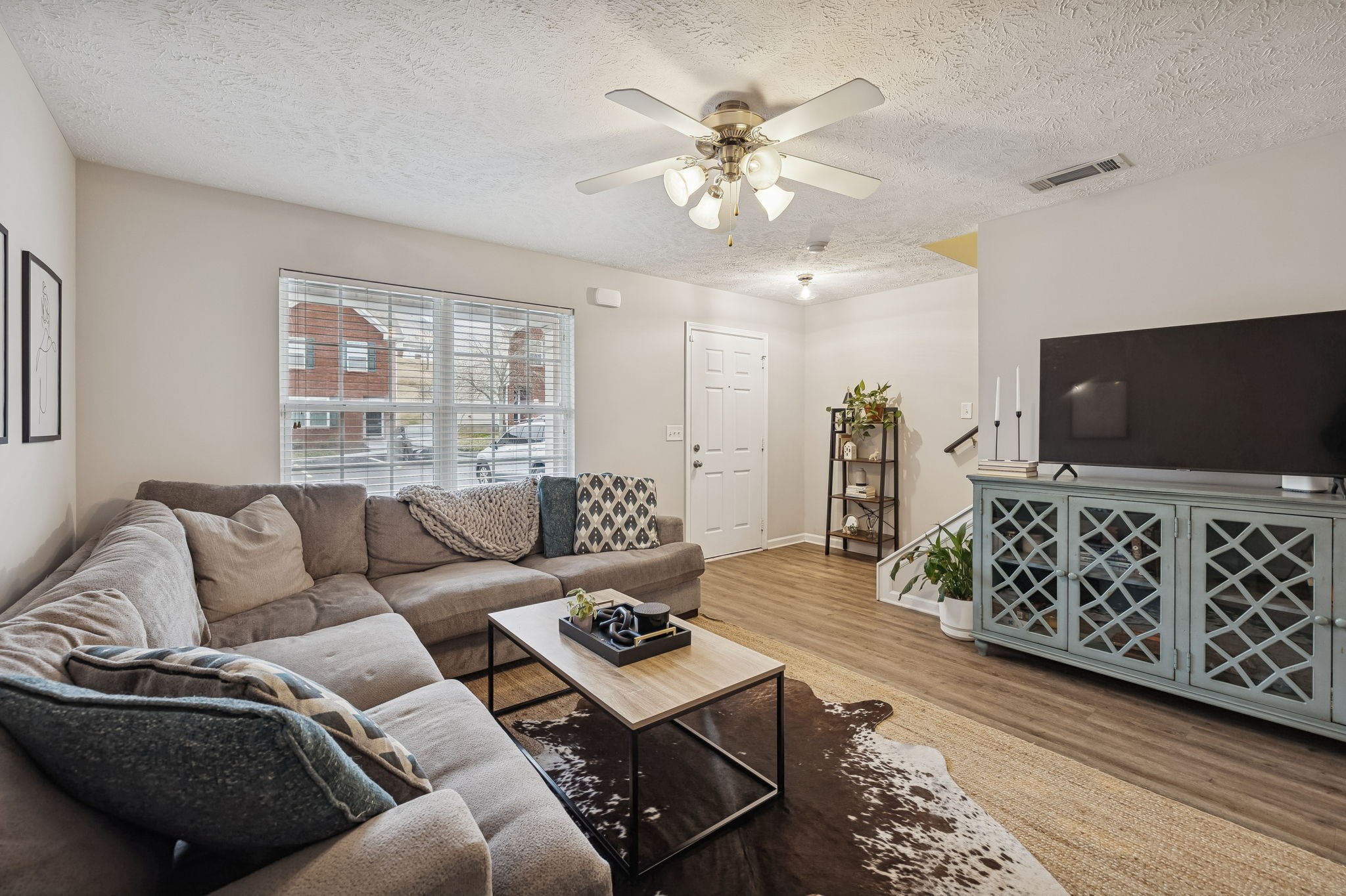 1834 Shaylin Loop Antioch, TN 37013 - Photo 5 of 28 a living room with furniture and wooden floor