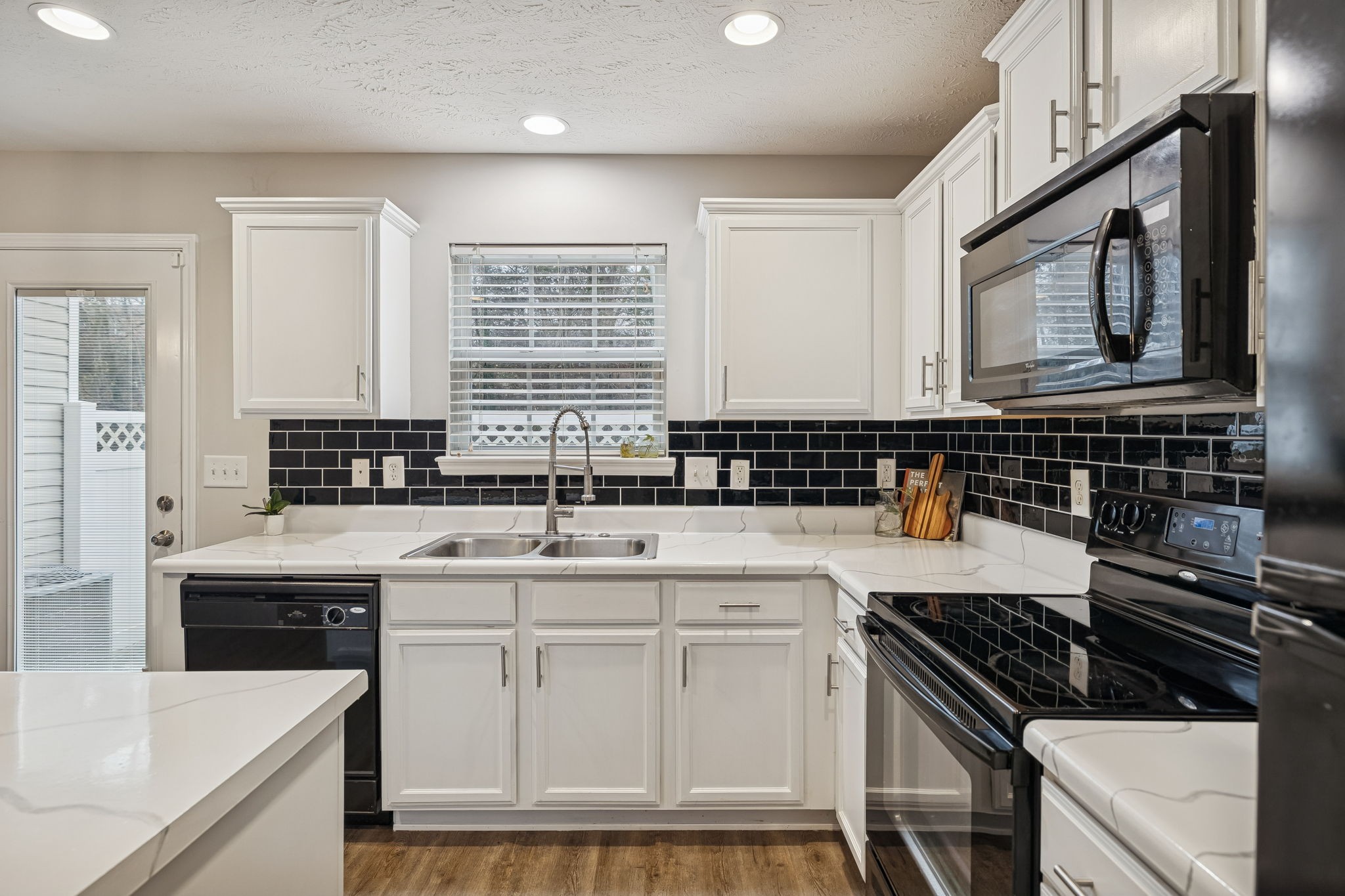 1834 Shaylin Loop Antioch, TN 37013 - Photo 9 of 28 a kitchen with granite countertop a sink stove and cabinets