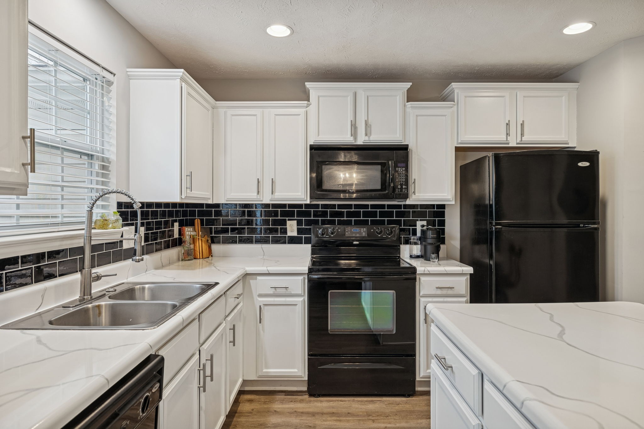 1834 Shaylin Loop Antioch, TN 37013 - Photo 10 of 28 a kitchen with a sink a stove and refrigerator