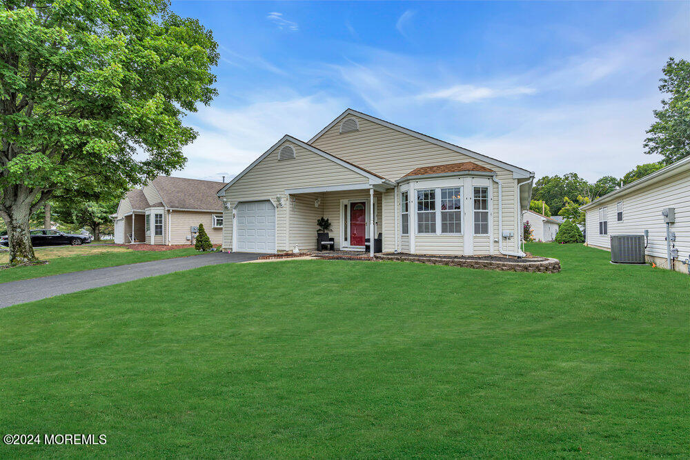 18 Mayapple Drive Brick, NJ 08724 - Photo 2 of 41 a view of a house with a big yard potted plants and large tree