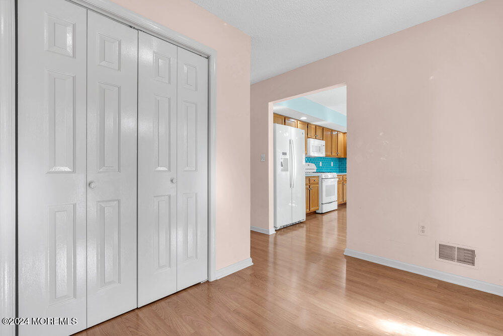 18 Mayapple Drive Brick, NJ 08724 - Photo 5 of 41 a view of a hallway with wooden floor