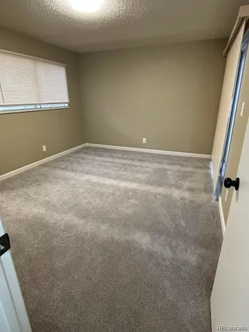 an empty room with mirror