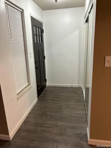 a kitchen with a refrigerator sink and cabinets