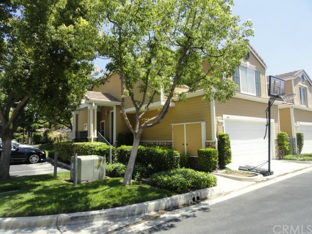 403 Pony Express Road San Dimas, CA 91773 - Photo 1 of 1 a front view of a house with a yard and trees