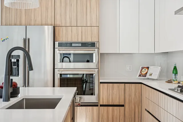 a kitchen with a white stove top oven and sink