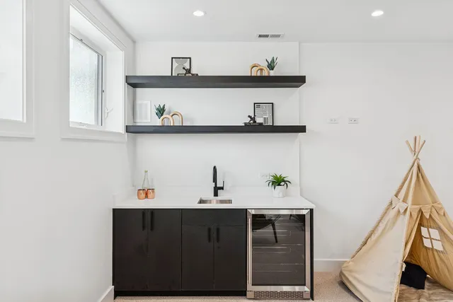 a view of cabinets a sink and dishwasher in a kitchen