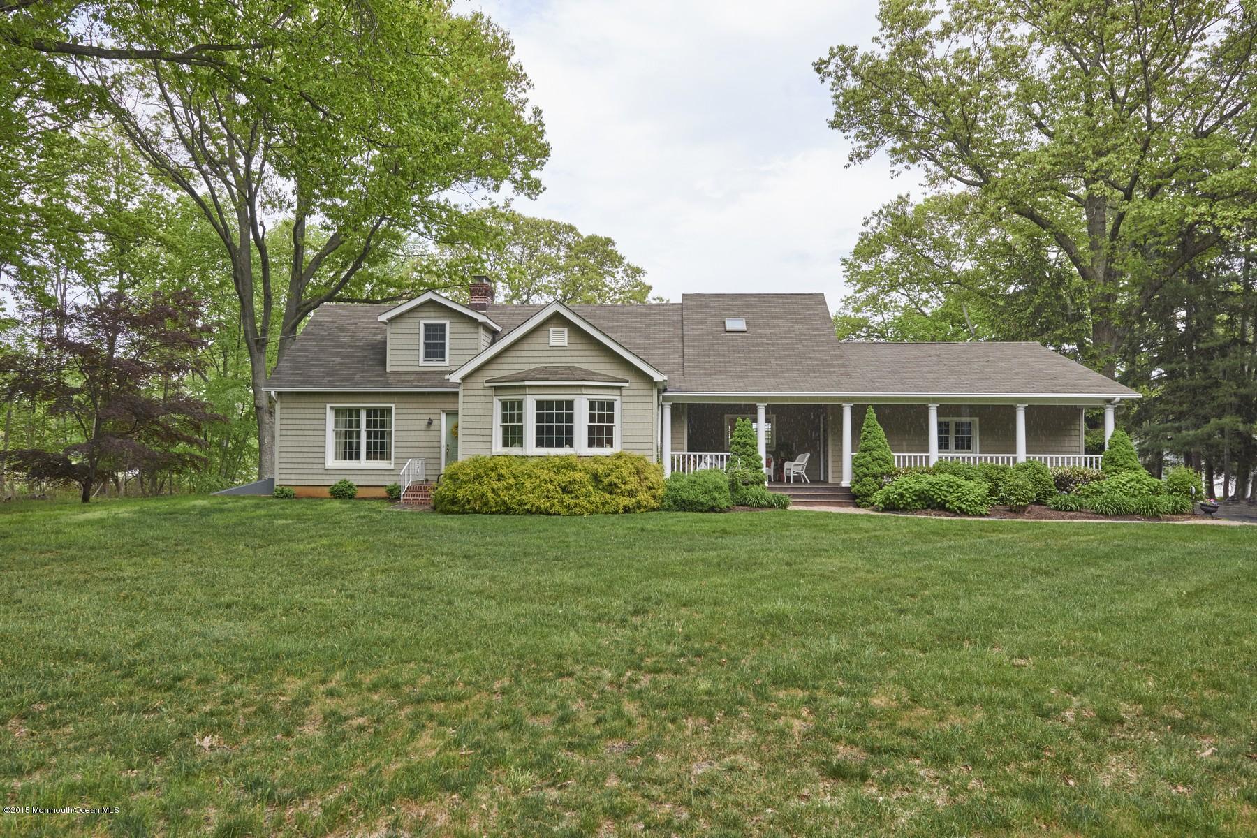 150 Bowne Road Middletown, NJ 07716 - Photo 1 of 20 a front view of a house with a garden