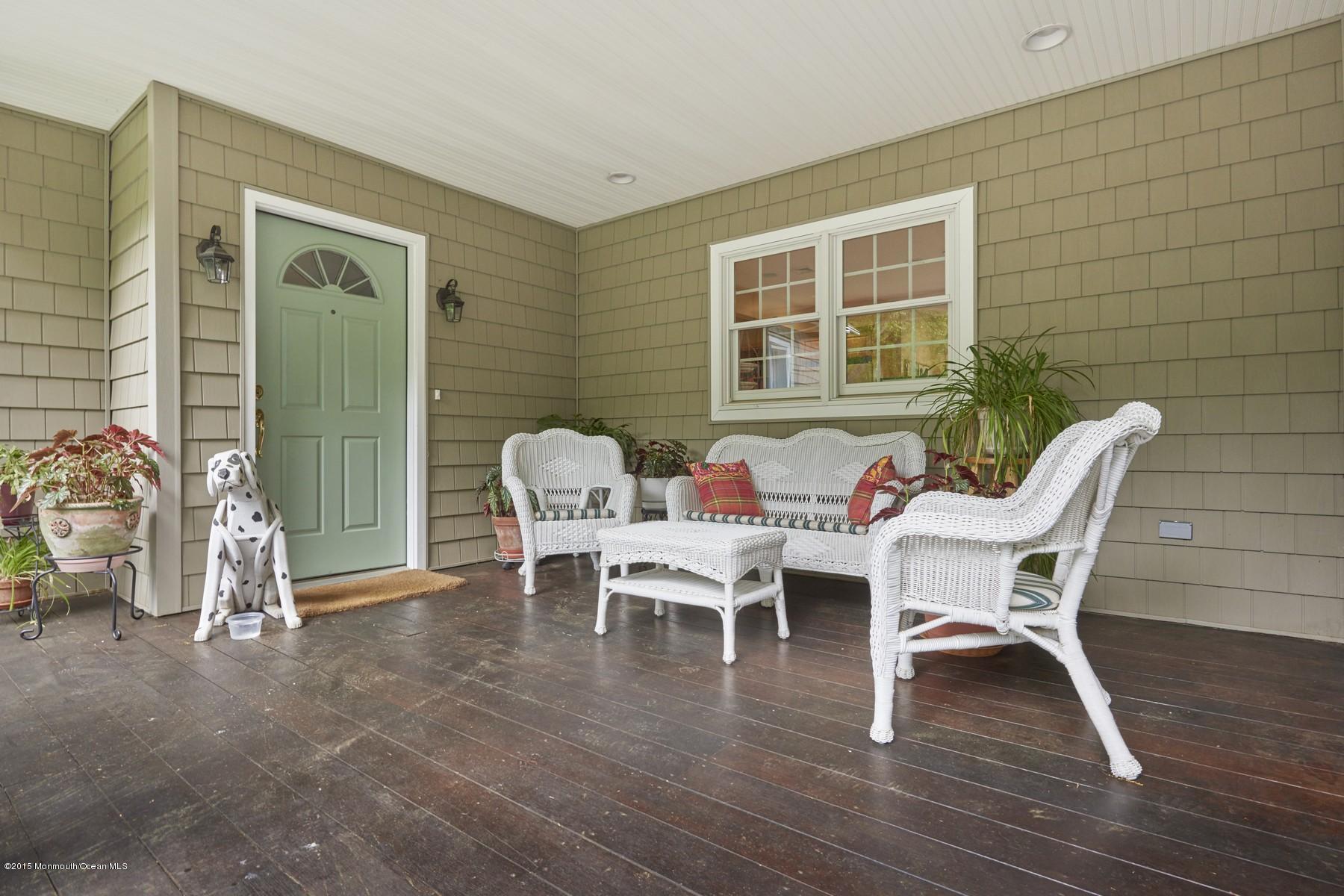 150 Bowne Road Middletown, NJ 07716 - Photo 2 of 20 a outdoor space with a couch and wooden floor