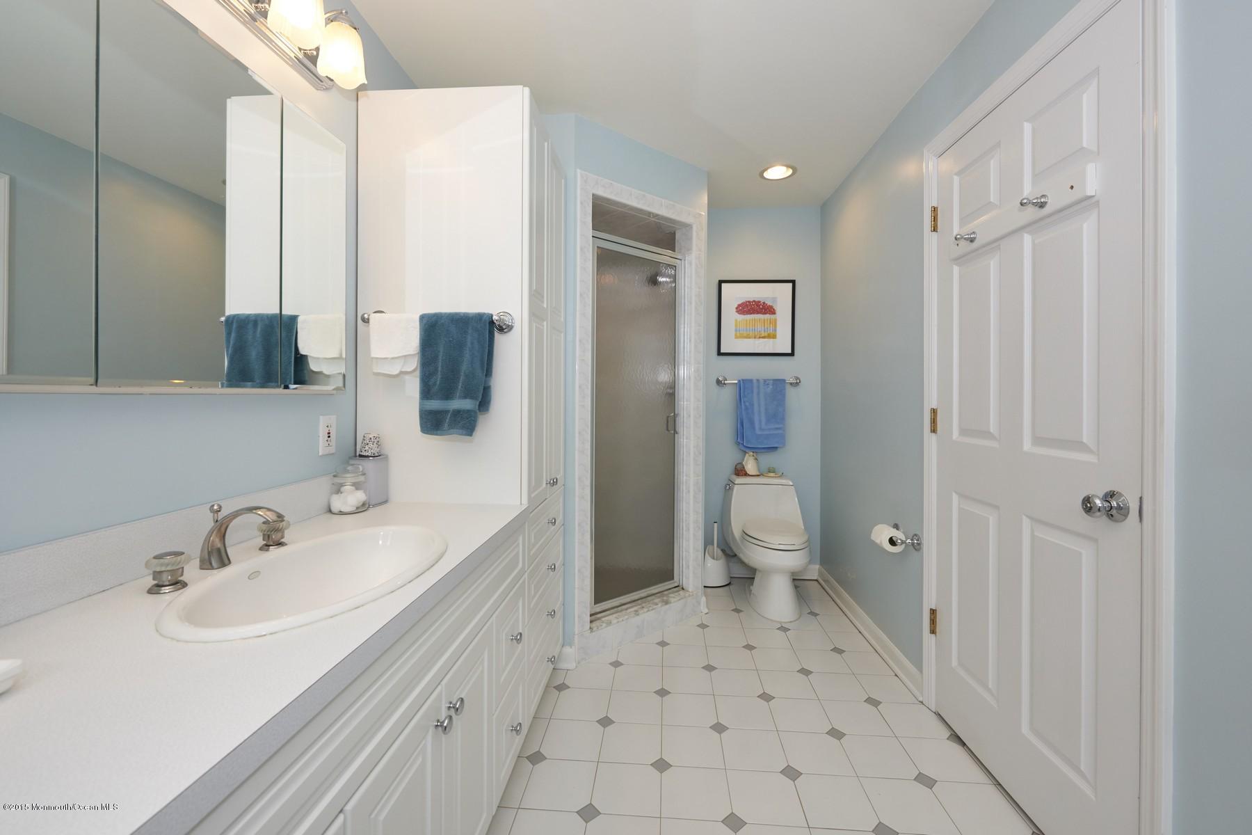 150 Bowne Road Middletown, NJ 07716 - Photo 11 of 20 a bathroom with a sink a toilet and shower