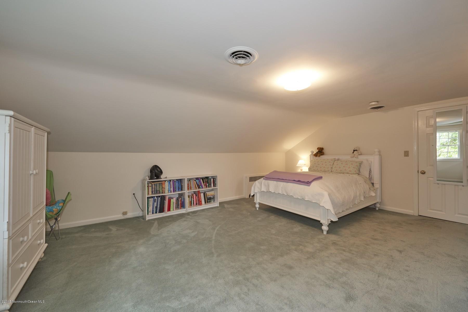 150 Bowne Road Middletown, NJ 07716 - Photo 13 of 20 a spacious bedroom with a bed and a couch