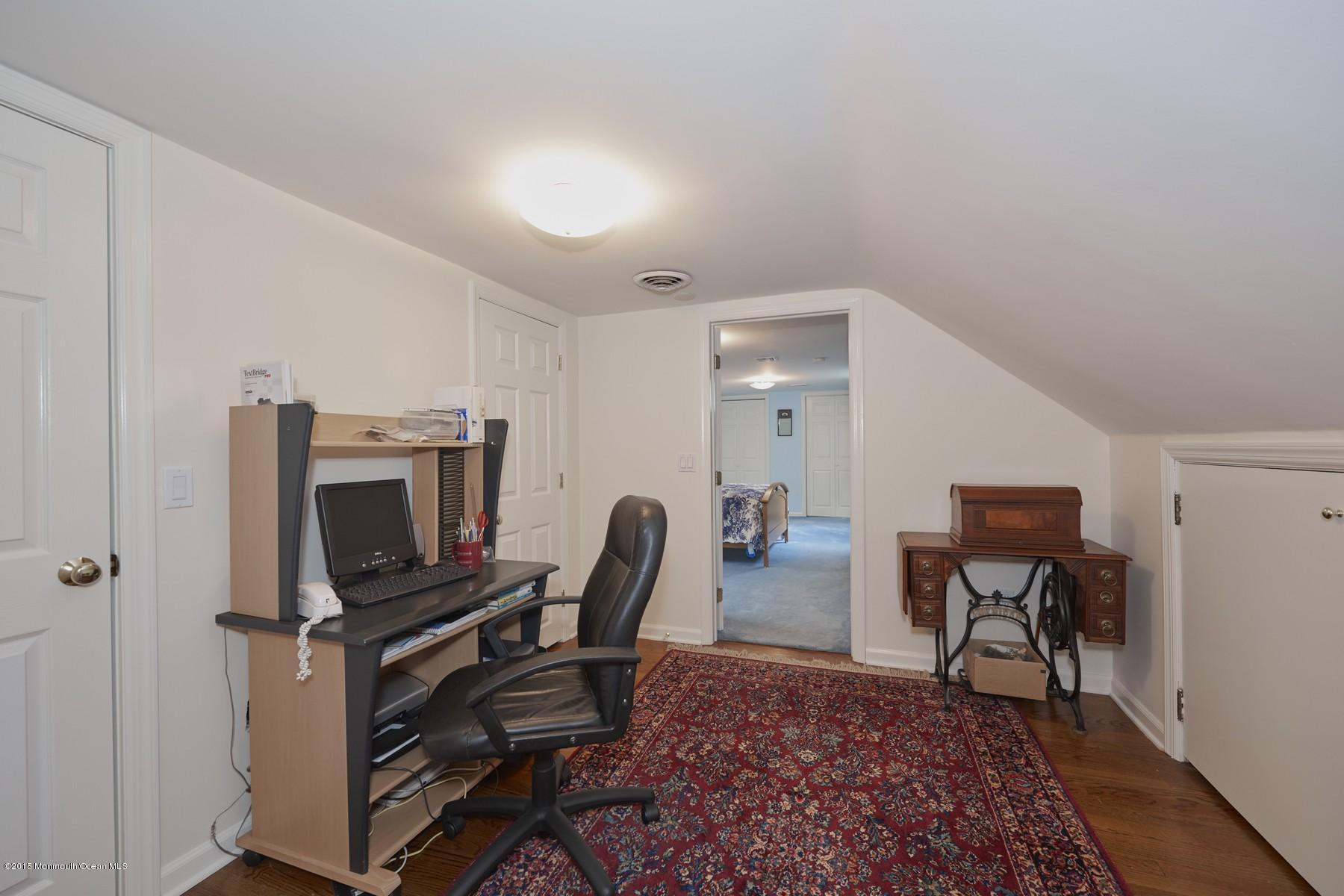 150 Bowne Road Middletown, NJ 07716 - Photo 15 of 20 a view of a workspace with furniture and a rug