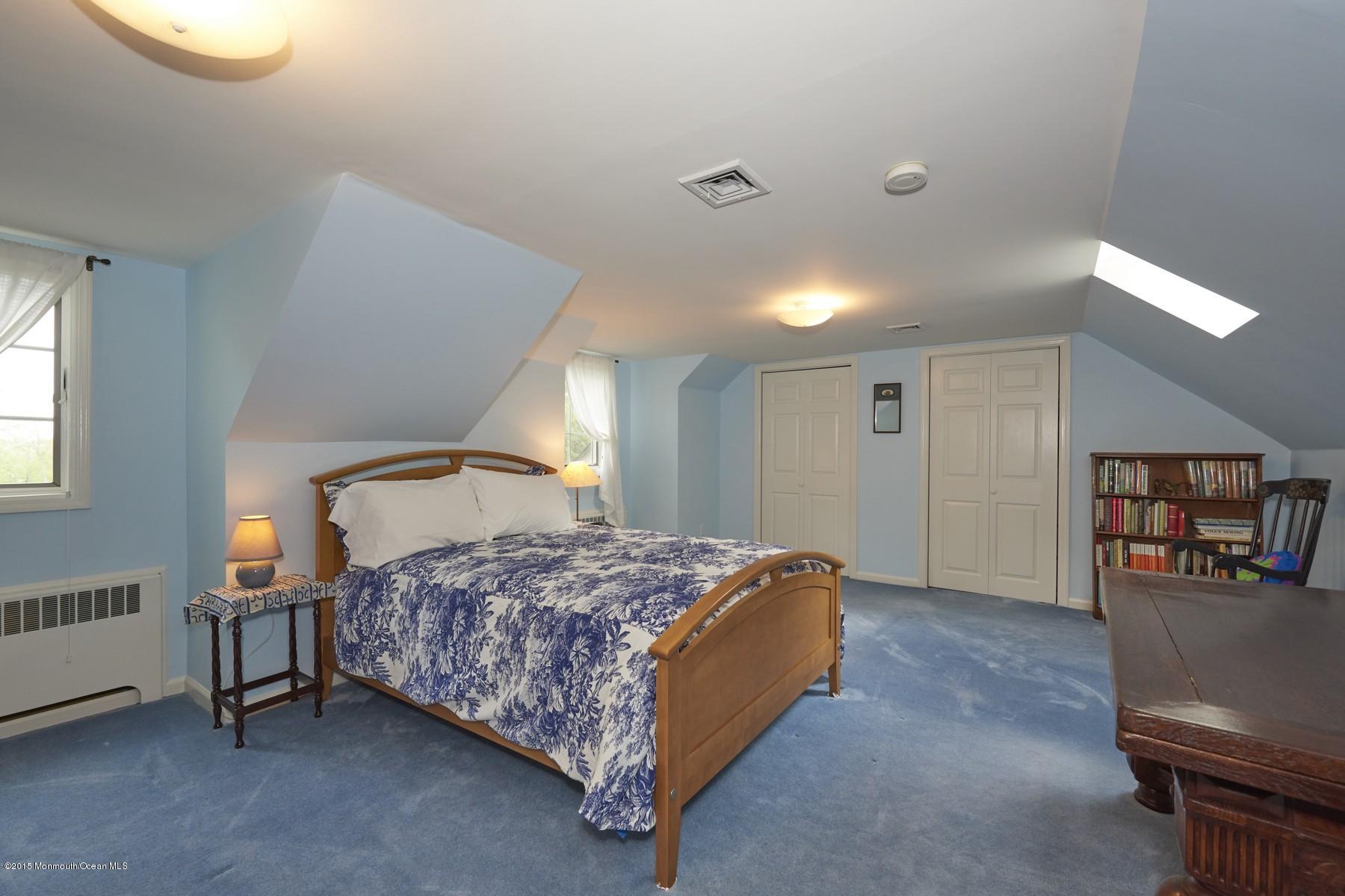 150 Bowne Road Middletown, NJ 07716 - Photo 16 of 20 a spacious bedroom with a bed and a cabinets