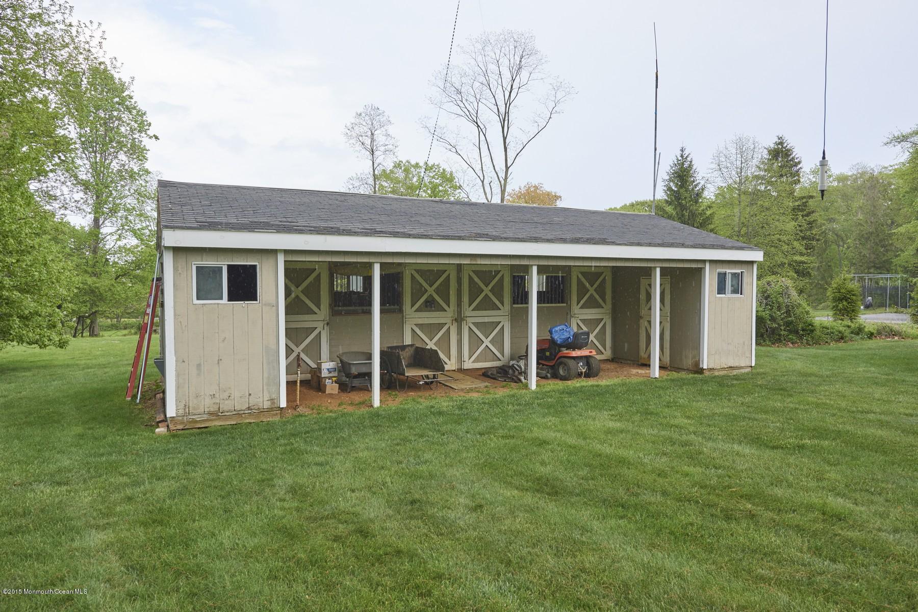 150 Bowne Road Middletown, NJ 07716 - Photo 19 of 20 a view of a house with a yard and sitting area
