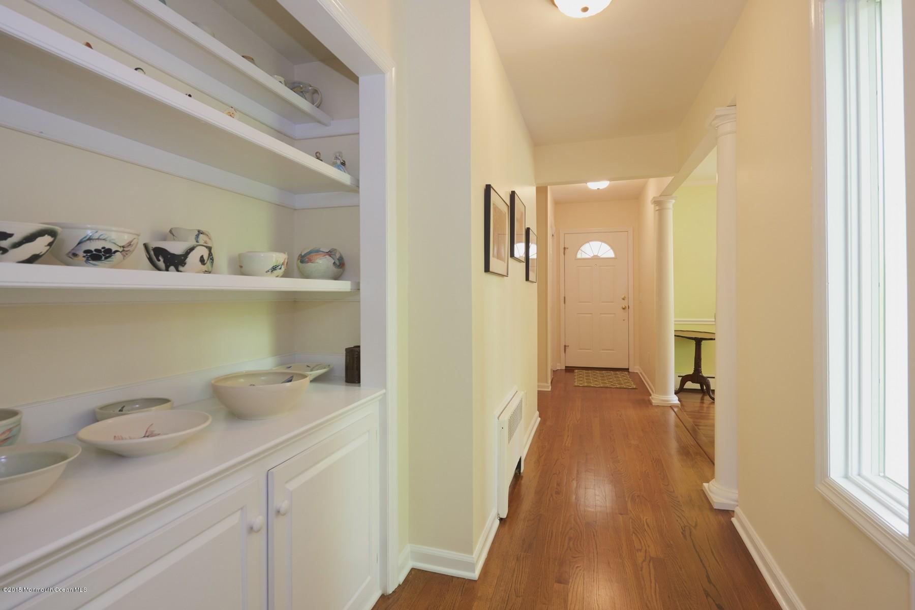 150 Bowne Road Middletown, NJ 07716 - Photo 5 of 20 a hallway with table and chairs