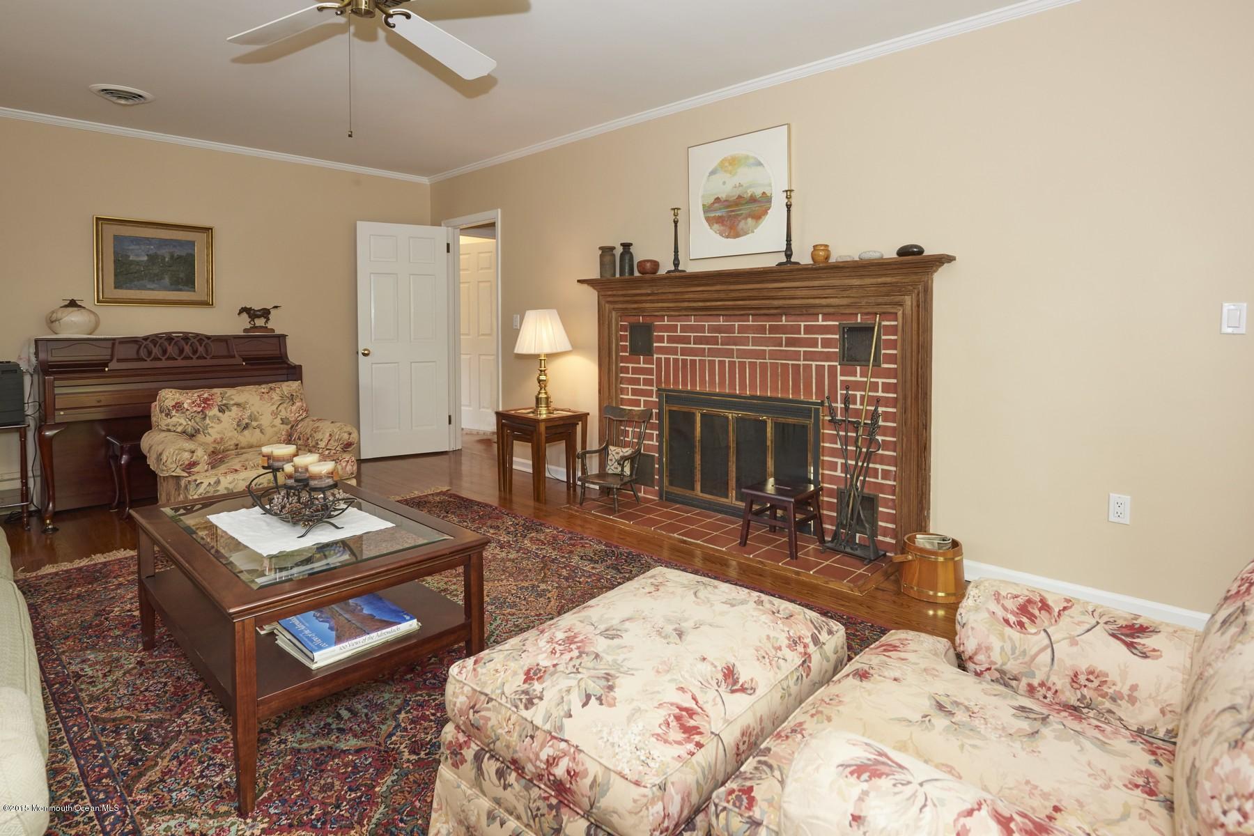 150 Bowne Road Middletown, NJ 07716 - Photo 8 of 20 a living room with furniture and a fireplace