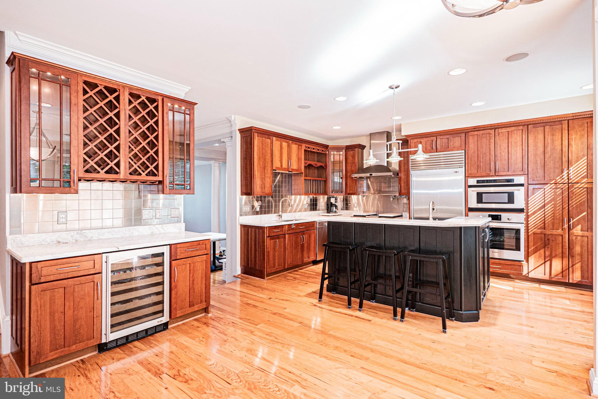 5448 Edsall Ridge Place Alexandria, VA 22312 - Photo 11 of 52 a kitchen with a sink stove and cabinets