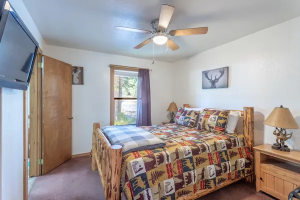 a bedroom with a bed and window