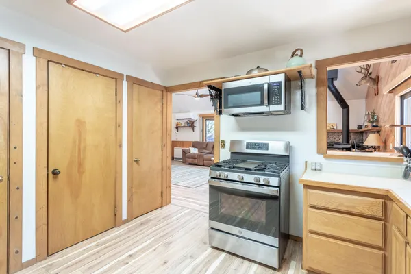 a kitchen with stainless steel appliances granite countertop a stove and a refrigerator