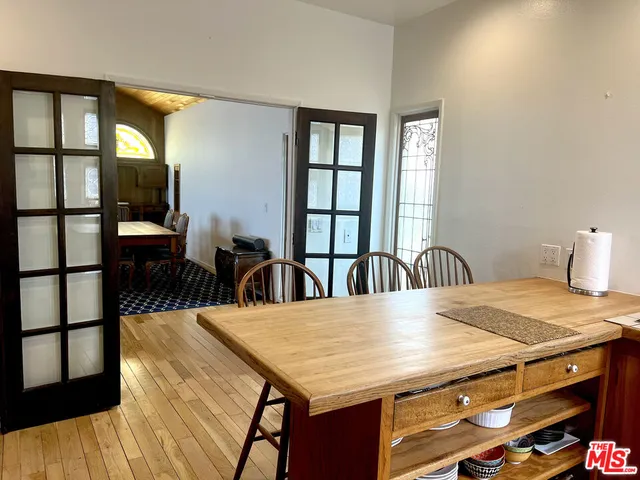 a dining room with a table and chairs