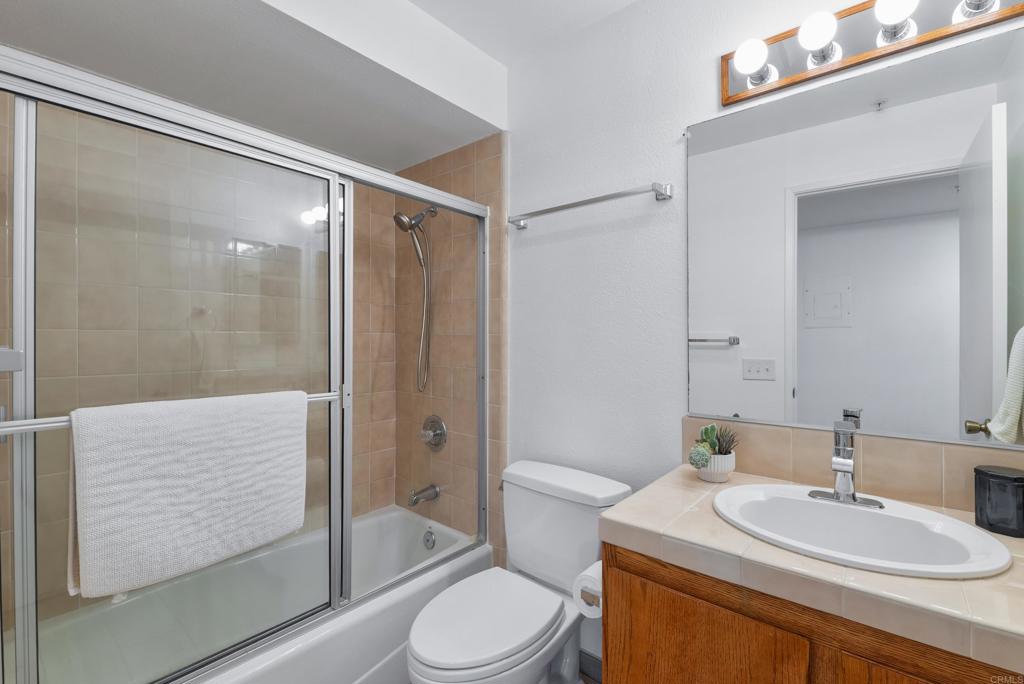 4055 Eagle Street, Unit 102 San Diego, CA 92103 - Photo 20 of 37 a bathroom with a sink toilet and shower