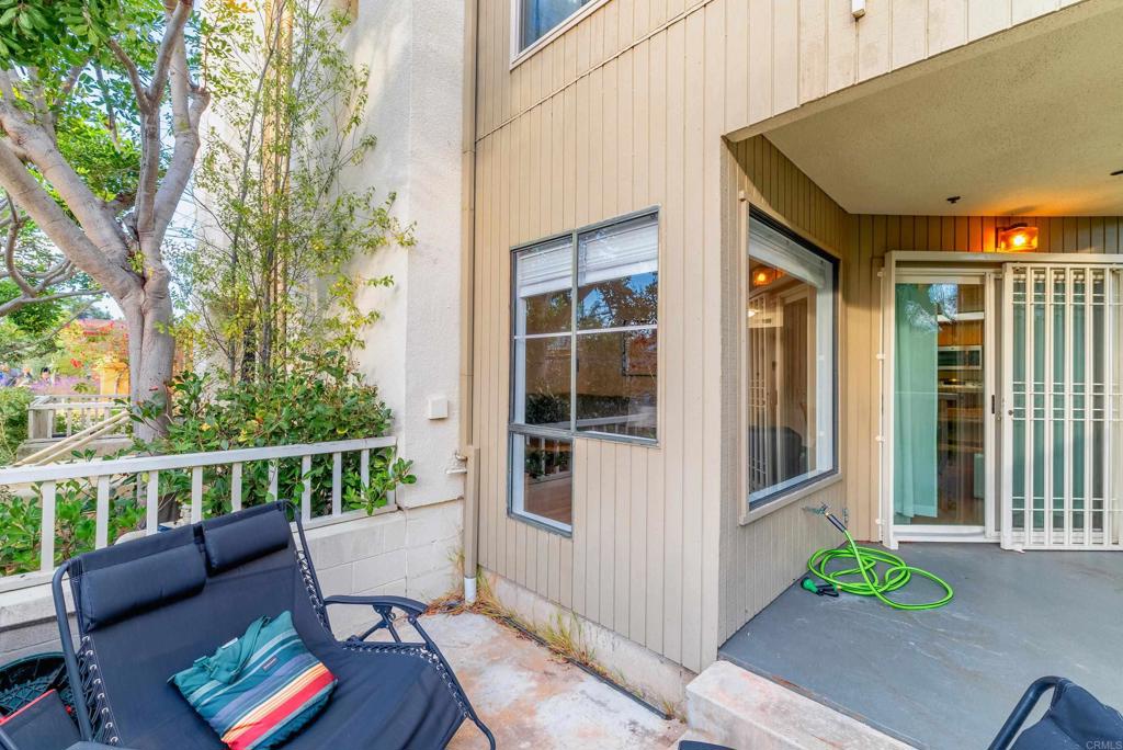 4055 Eagle Street, Unit 102 San Diego, CA 92103 - Photo 23 of 37 a view of a chair and tables in the balcony