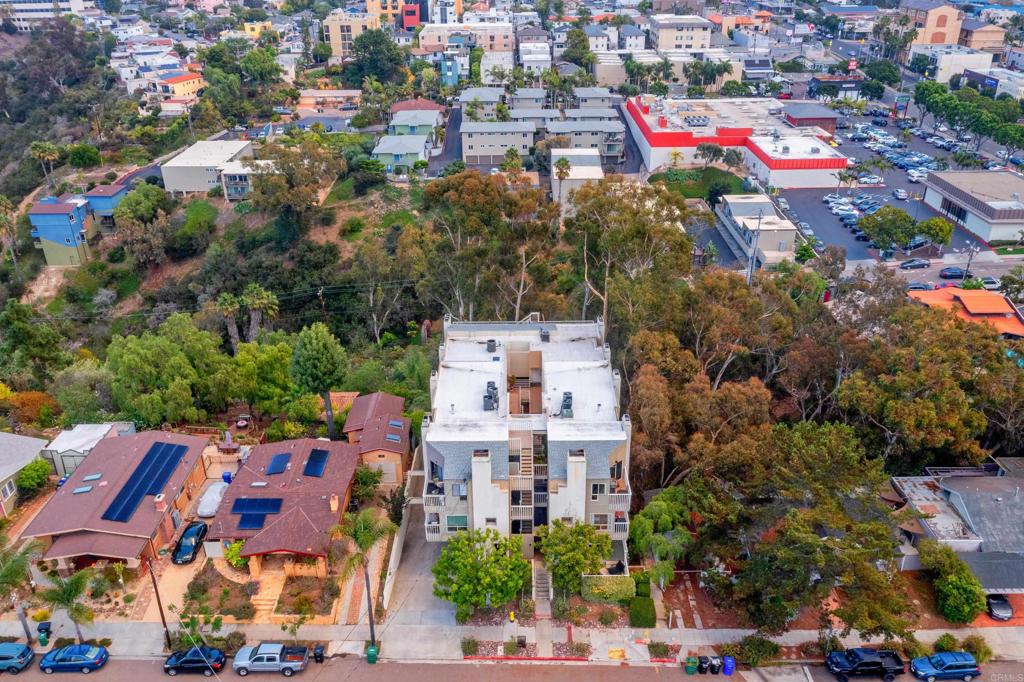 4055 Eagle Street, Unit 102 San Diego, CA 92103 - Photo 34 of 37 an aerial view of residential houses with outdoor space