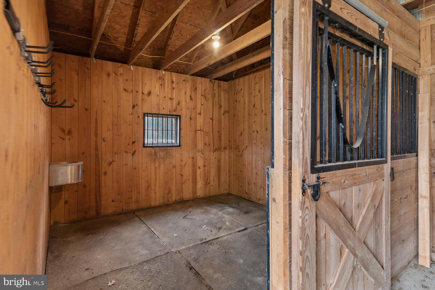 313 Wye Road Queenstown, MD 21658 - Photo 114 of 132 Spacious wooden stall with rustic charm.
