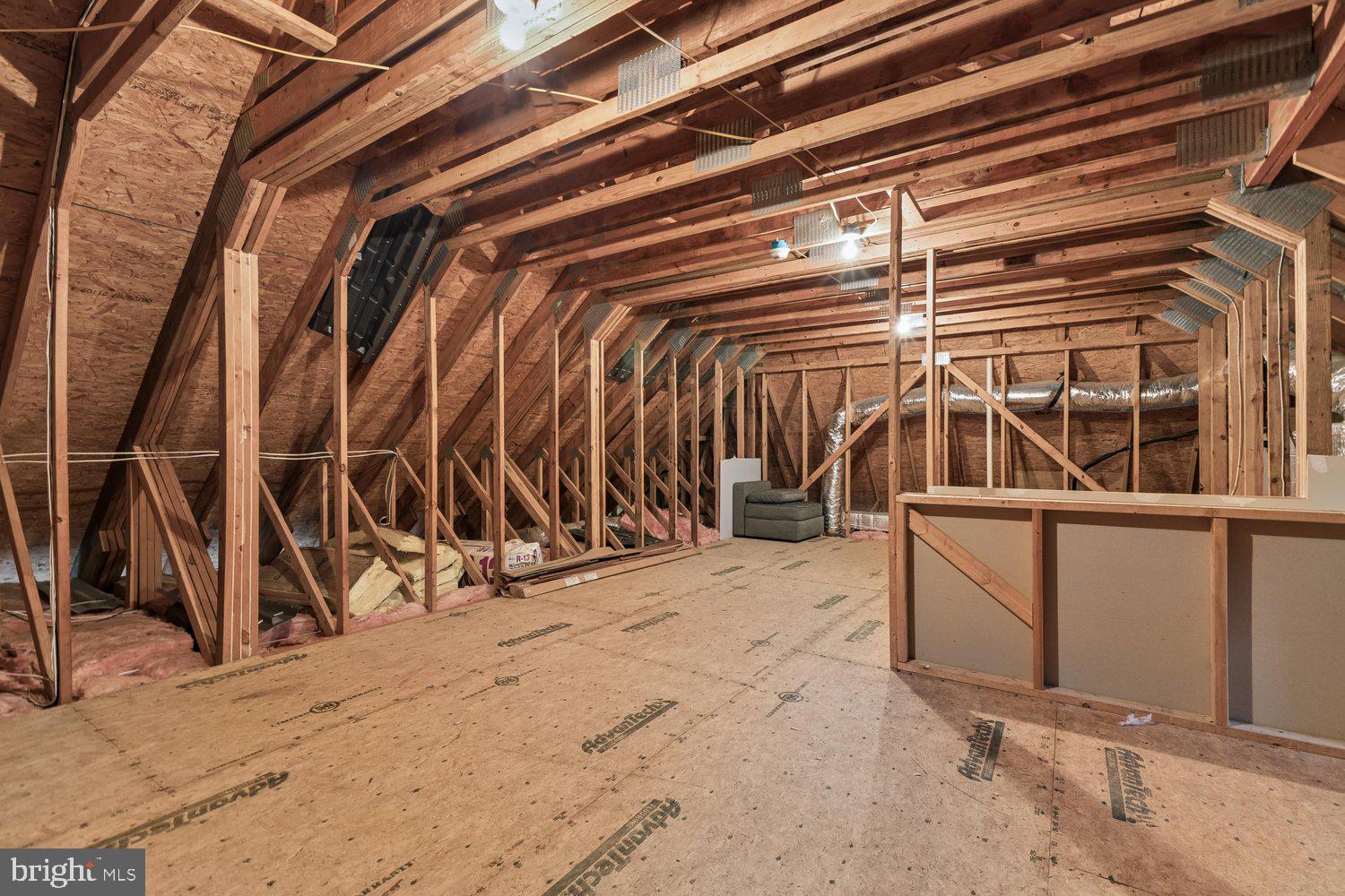 313 Wye Road Queenstown, MD 21658 - Photo 123 of 132 Spacious attic with exposed beams and potential.